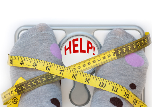 Closeup of feet on weighing scales